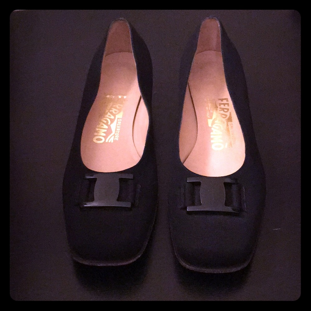 Black loafers with buckle accent